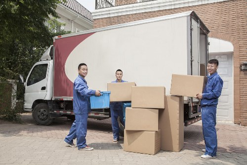 Removal van and moving boxes in a Tolworth residential street
