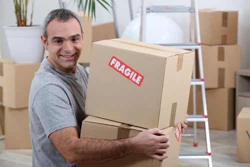 Team loading furniture safely into a van