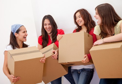 Professional movers handling furniture during a home move in Tolworth