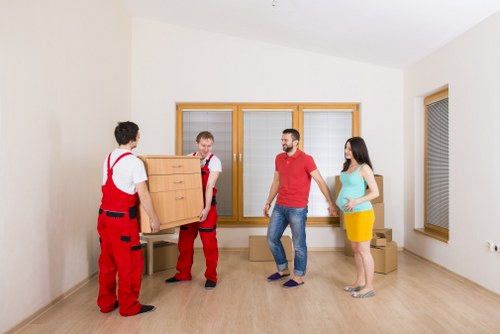 Local movers handling furniture from a flat near Tolworth busy routes