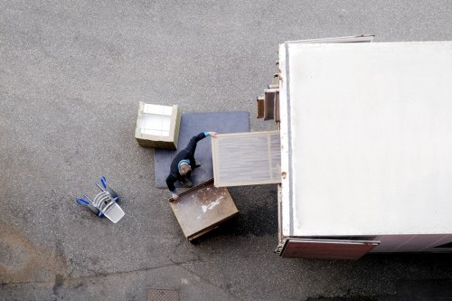 Packed moving boxes and furniture ready for relocation in Tolworth