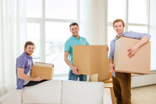 Loading furniture and boxes into a removals van in Tolworth