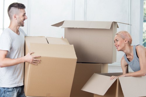 Local movers handling boxes and furniture near Tolworth