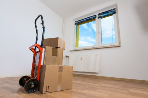 Trained removal staff preparing furniture for transport