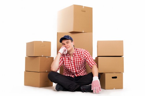 Professional movers loading furniture for a Tolworth relocation