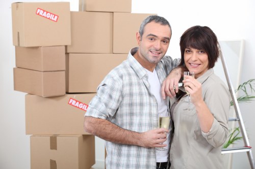 Organised moving boxes and labelled packing supplies for a Tolworth property